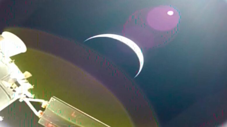Earth's crescent is seen from a solar array camera on the Orion spacecraft on the first flight day of the Artemis II mission. Credit: NASA